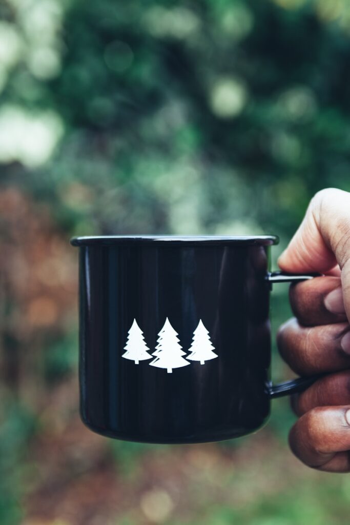 Photo by Clem Onojeghuo selective focus photography black and white mug